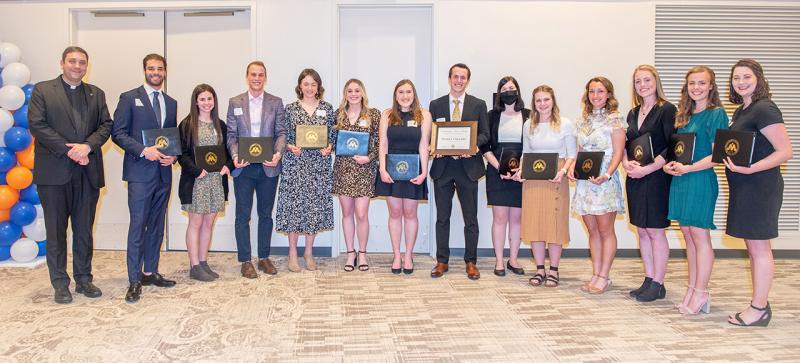 University of Mary President Monsignor James Shea with 2021 Outstanding Senior Nominees