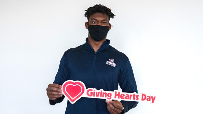 Philip Springsteen photo holding a giving day sign