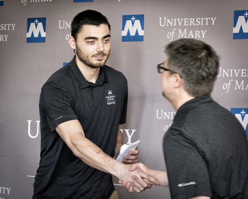 Dr Terry Pilling Congratulates Michael Gorder-on-Being-FIrst-UMary-School-of-Engineering-Graduate