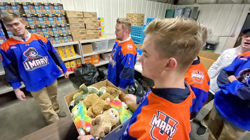 Hockey team with a box of bears