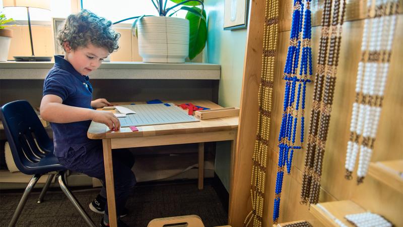 Montessori Students working on an assignment