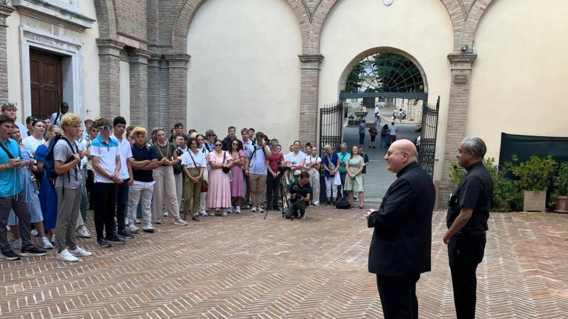 High school students visiting the tomb of Carlo Acutis.