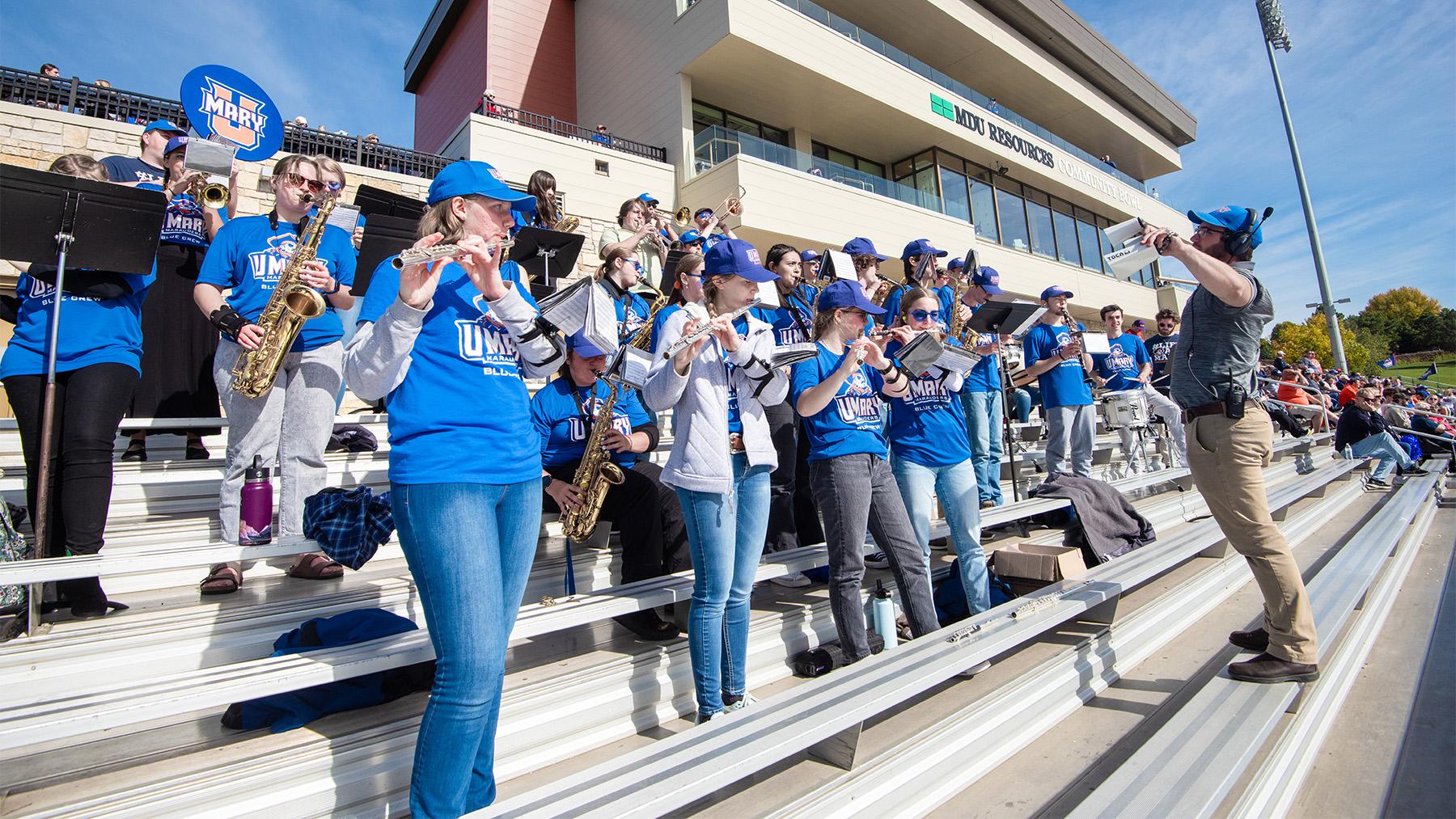 Pep band students at a football game