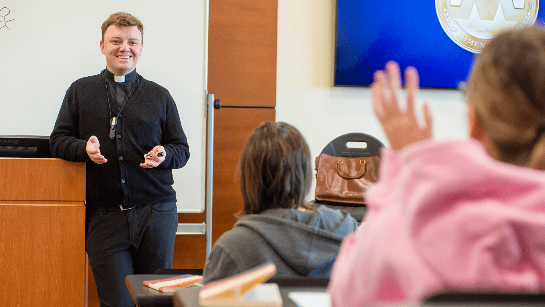 Fr Bouck teaching a Catholic Studies class.