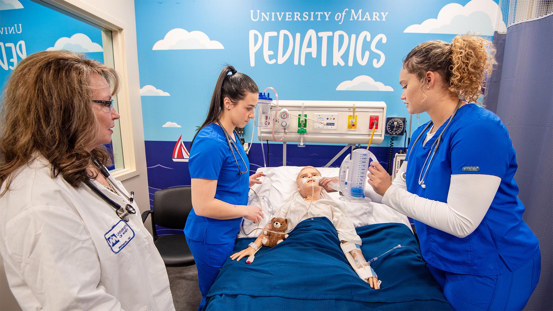 Nursing Students practicing in the nursing simulation labs