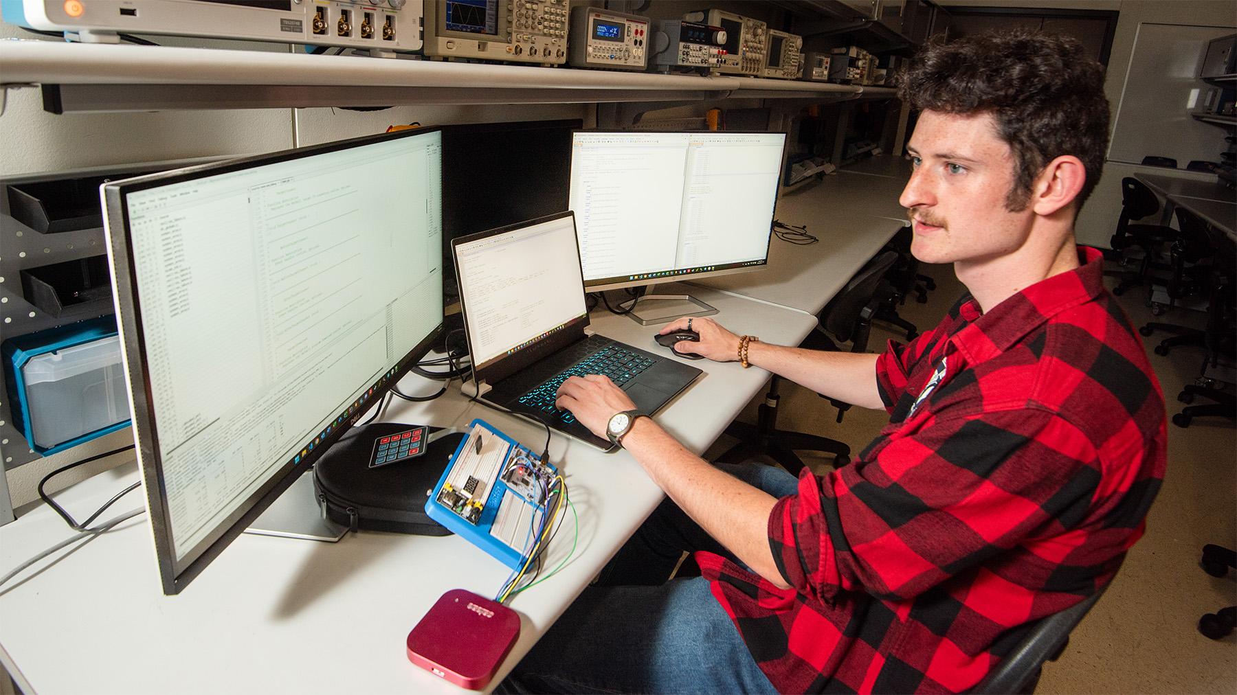 Student programing a device.