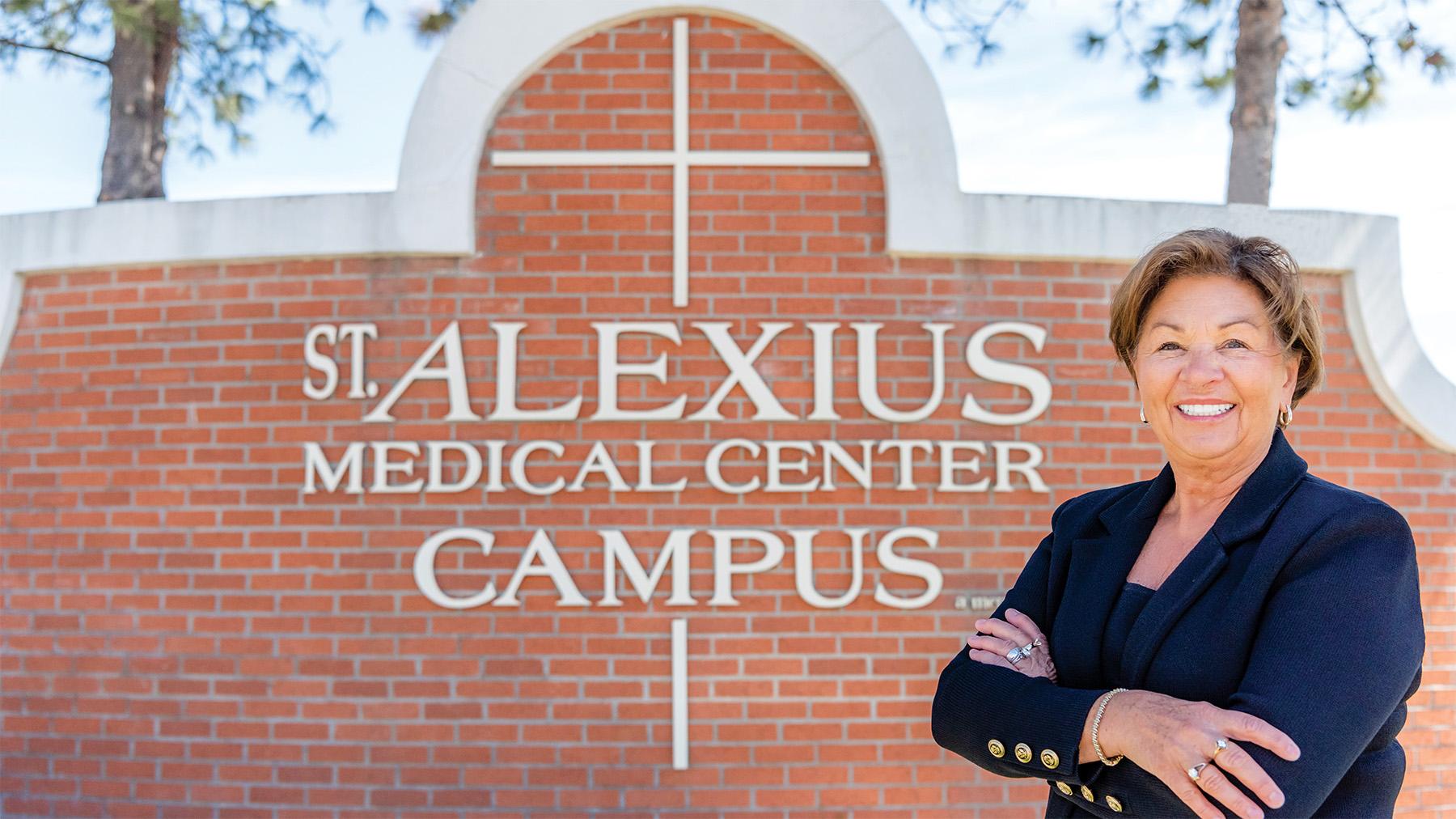 Linda Knodel's Headshot in front of St. Alexius Sign.