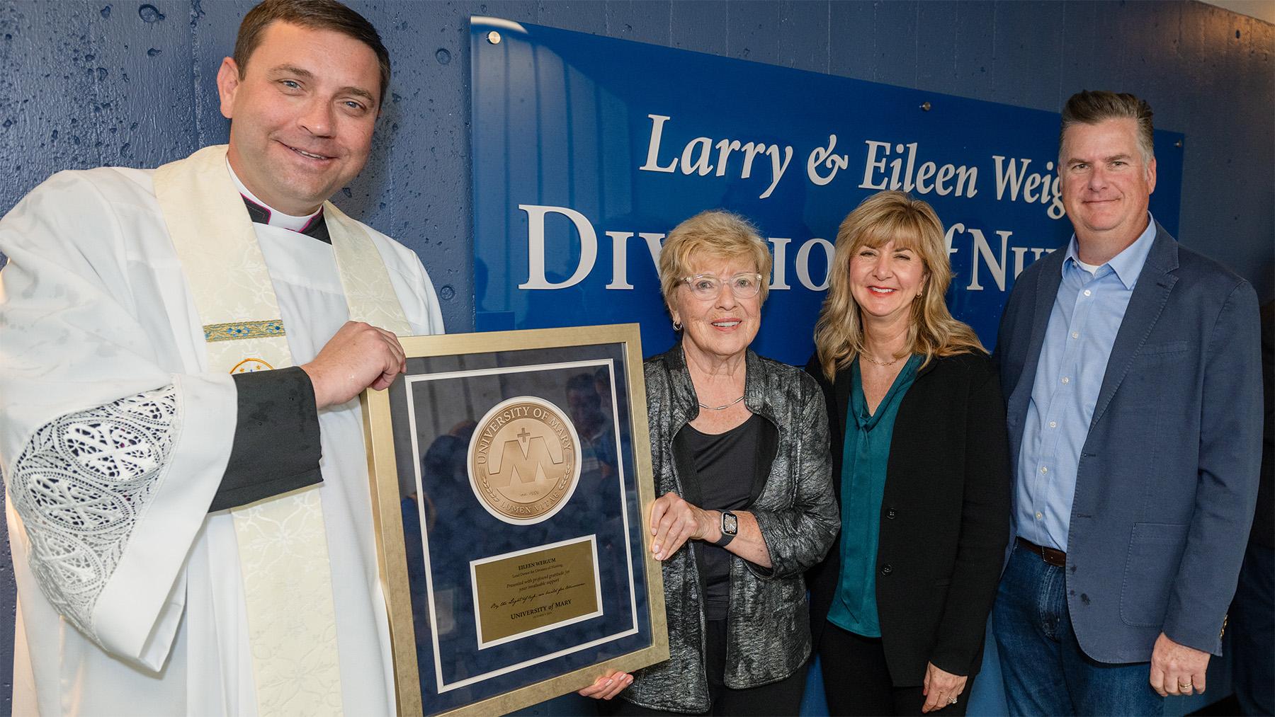 Weigum Nursing Dedication photo with the Weigums and Monsignor Shea