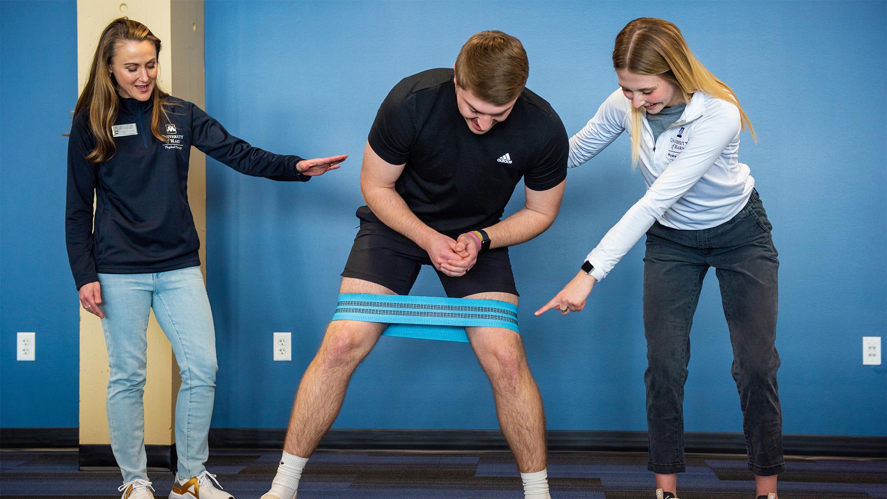 Students practicing with a PT band