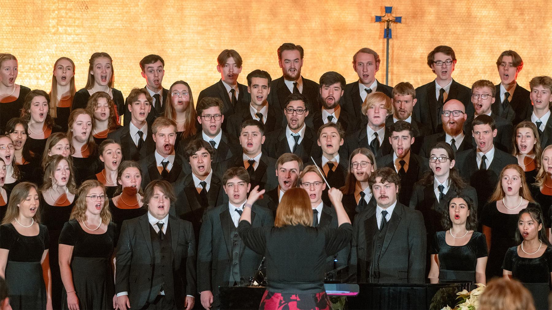 Student singing at Christmas at Mary